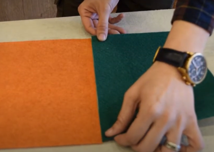 The supplier showing how to align orange and green event carpet
